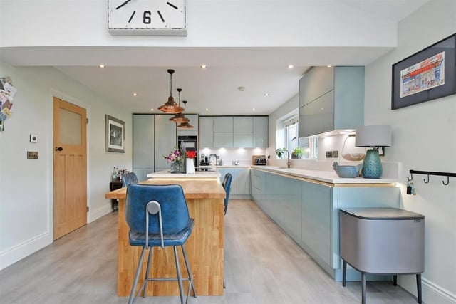 The house boasts a truly impressive open plan dining kitchen/family room with Quartz work surfaces, high quality integrated appliances, a bi-fold door and a 'Neville Johnson' bespoke book/display unit