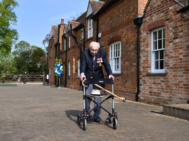 Captain Tom Moore completed 100 laps of his garden on April 16, 2020, in a fundraising challenge for healthcare staff that has "captured the heart of the nation". (Photo by Justin TALLIS / AFP)
