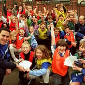 Sheffield Wednesday's Ryan Jones (left) and Ian Knight (right) pictured with pupils from the Greengate Lane Primary School, High Green, Sheffield, after a coaching session, December 9, 1996