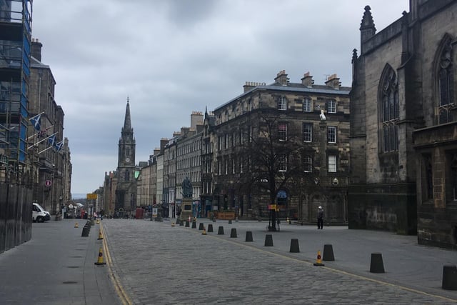 The Royal Mile in Edinburgh, often seen booming with tourists, is pictured almost completely deserted amid the coronavirus pandemic.