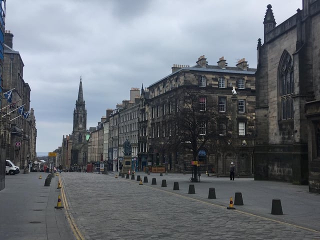 The Royal Mile in Edinburgh, often seen booming with tourists, is pictured almost completely deserted amid the coronavirus pandemic.