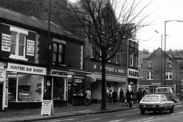 Shops on Ecclesall Road, Sheffield, approaching Hunters Bar roundabout, in 1983, including Hunters Bar Bakery and Dolls House antique dealers.