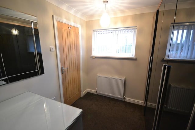 Besdroom 4 - A front facing singe bedroom which is currently used as a dressing room with a upvc double glazed window, power sockets, central heating radiator and coving to the ceiling.