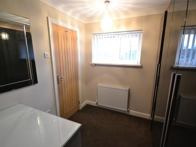 Besdroom 4 - A front facing singe bedroom which is currently used as a dressing room with a upvc double glazed window, power sockets, central heating radiator and coving to the ceiling.