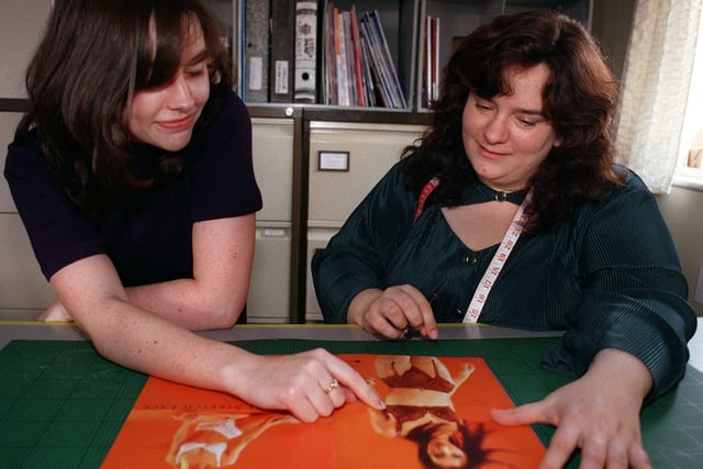 Designer Clare Fallon, left, and head designer Liesl George look over the 1999 brochure for Panache lingerie at Barbot Hall Industrial Estate, Rotherham