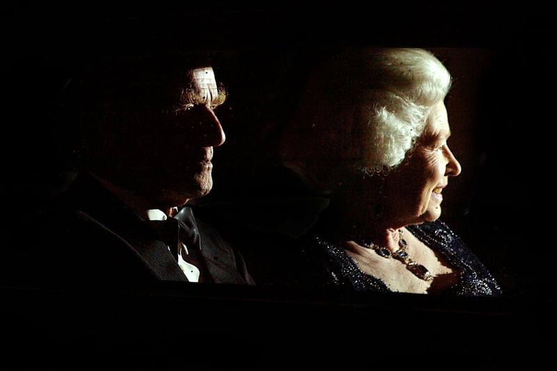 The Queen and her husband Prince Philip leave after attending The Queen's Party of Thanks at the Ritz Hotel November 14, 2002 in London.  The Queen hosted the party for close friends and family, thanking them for making her Jubilee year a success. The event was held on Prince Charles's 54th birthday.  (Photo: Scott Barbour/Getty Images)