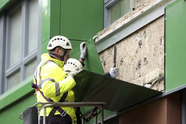 Part of the cladding at Hanover Way tower block being removed and replaced 