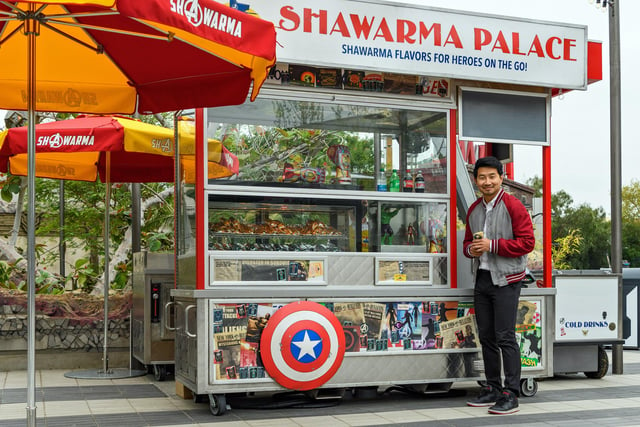 Simu Liu visits Shawarma Palace in Avengers Campus. Picture: Richard Harbaugh/Disneyland Resort via Getty Images