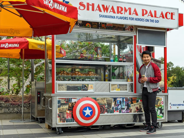 Simu Liu visits Shawarma Palace in Avengers Campus. Picture: Richard Harbaugh/Disneyland Resort via Getty Images