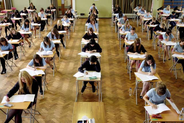 File photo dated 11/06/08 of pupils sitting an exam. More generous grading, advance notice of exam topics and additional papers are among the promises by the Department for Education to make up for the disruption faced by students during the pandemic. Chris Radburn/PA Wire