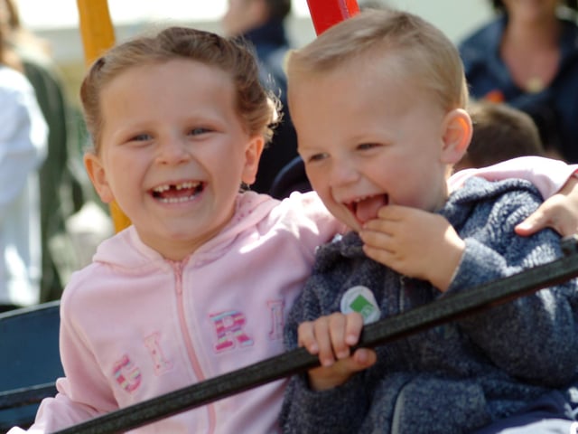 Chloe Green, 5, and her 3 year old brother Alex enjoying the rides.
