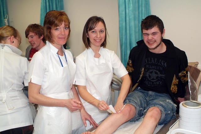 Docnaster College students raised hundreds of pounds for charity through an array of fundraising activities, including leg waxing in 2007. Picture  shows student Aaron Canning having his legs waxed by hair and beauty staff.