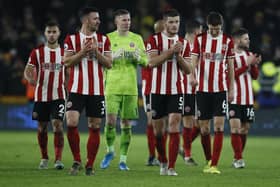 Sheffield United goalkeeper Dean Henderson, who is on loan from Premier League rivals Manchester United, flanked by his team mates from Bramall Lane: Simon Bellis/Sportimage