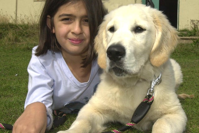 Pictured at the  at the Sheffield Dog rescue Fun Dog show are Sophie Sharif, eight,  with Golden retriever Paddy  in 2003
