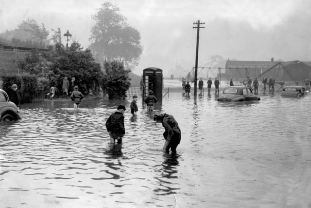 Struggling through the flood water at Firth Park terminus in the 1954