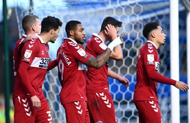 BIRMINGHAM, ENGLAND - DECEMBER 19:  Britt Assombalonga of Middlesbrough  celebrates with Marvin Johnson and teammates after scoring their team's first goal  during the Sky Bet Championship match between Birmingham City and Middlesbrough at St Andrew's Trillion Trophy Stadium on December 19, 2020 in Birmingham, England. The match will be played without fans, behind closed doors as a Covid-19 precaution. (Photo by Laurence Griffiths/Getty Images)