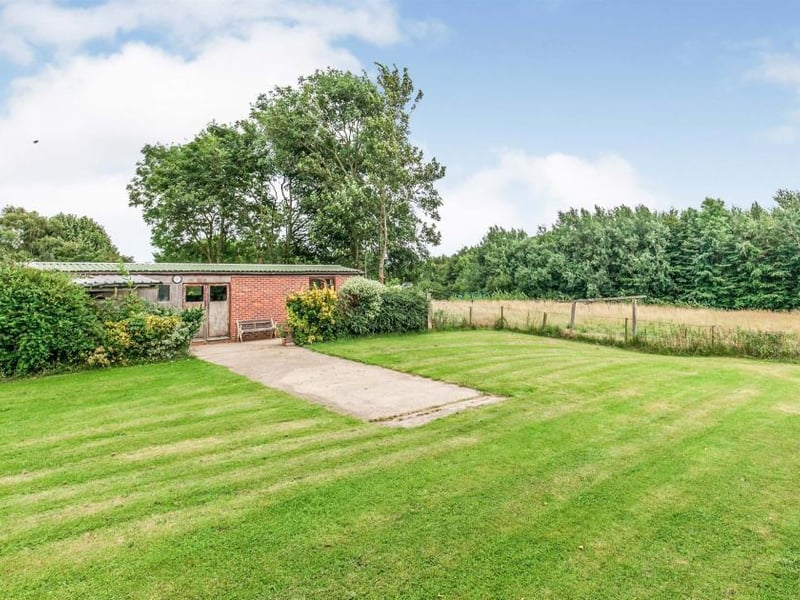 This is the first of five pictures that give you an idea of the green space and the buildings outside the property. All surrounded by trees, bushes and hedgerows.