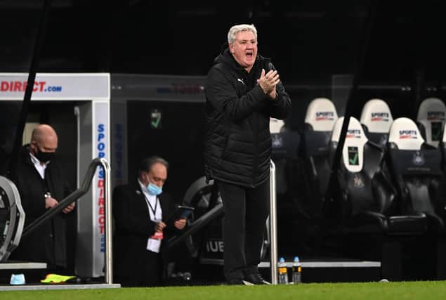 Newcastle United manager Steve Bruce applauds his team on the sideline during the Premier League match between Newcastle United and Wolverhampton Wanderers at St. James Park on February 27, 2021.