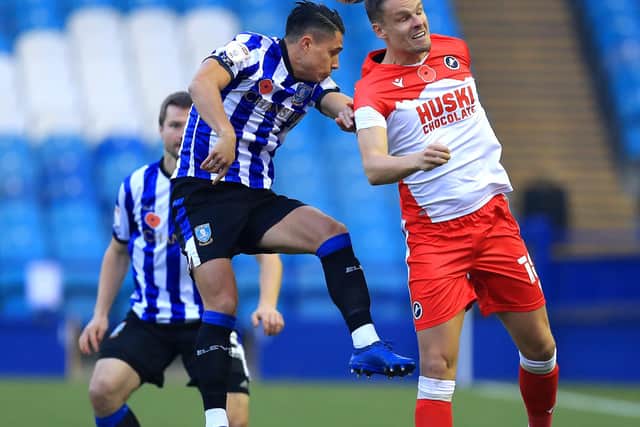 Sheffield Wednesday's Joey Pelupessy battles for possession with Ryan Leonard of Millwall. (Photo by George Wood/Getty Images)