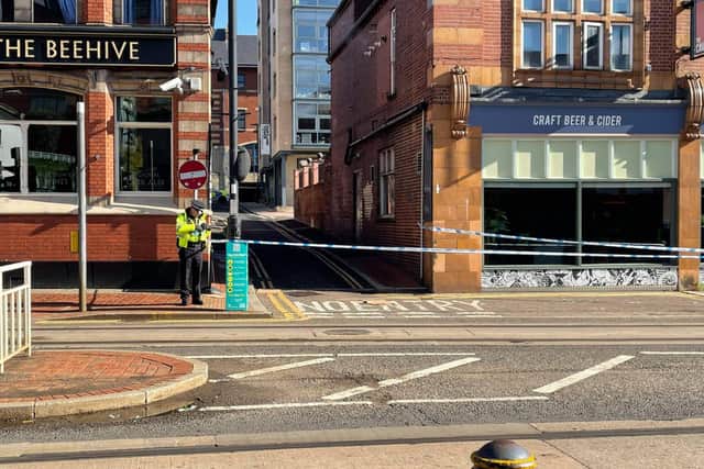 An alleyway off West Street in Sheffield city centre is cordoned off this morning