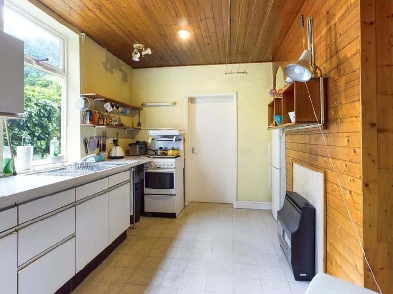 Kitchen with a range of fitted units