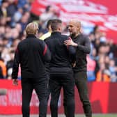 Manchester City manager Pep Guardiola (right) and Sheffield United manager Paul Heckingbottom: John Walton/PA Wire.