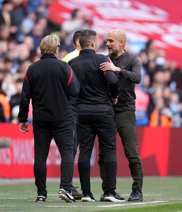 Manchester City manager Pep Guardiola (right) and Sheffield United manager Paul Heckingbottom: John Walton/PA Wire.