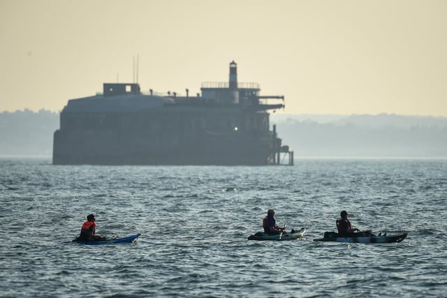 Kayakers enjoy the evening sunshine on Southsea beach taken by Finnbarr Webster/Getty Images