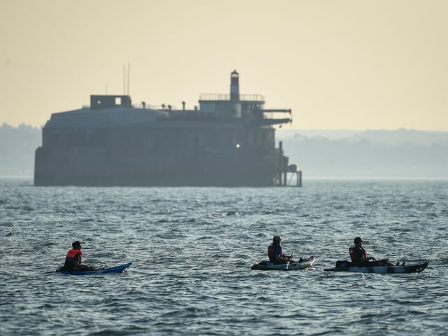 Kayakers enjoy the evening sunshine on Southsea beach taken by Finnbarr Webster/Getty Images