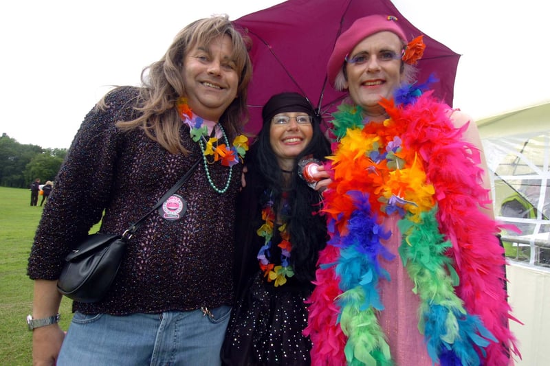Malcolm, Tracey and Peter shelter from the rain showers at Sheffield Pride 2009