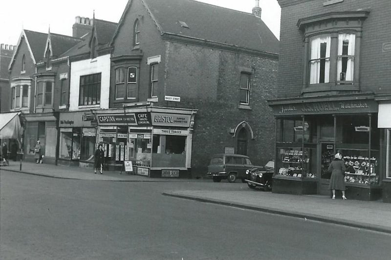 This undated photograph shows Ruell's jeweller and an unnamed cafe.