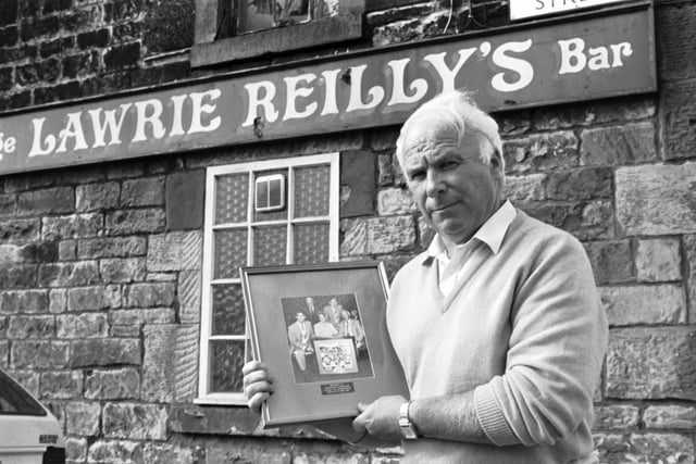 Lawrie Reilly said the news that Hearts FC chairman Wallace Mercer planned a takeover of Hibernian was 'unbelievable' in June 1990. Reilly, former Hibs player and one of the Famous Five, is pictured outside his bar in Leith.