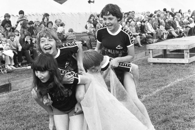 Youngsters from St Columba's Scouts and Guides, Southwick, pictured in It's A Knockout action at Seaburn in 1979.