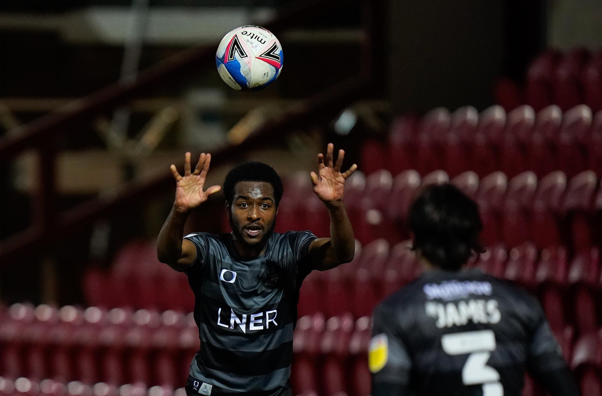 Cameron John throws in to Reece James. Picture: Steve Flynn/AHPIX