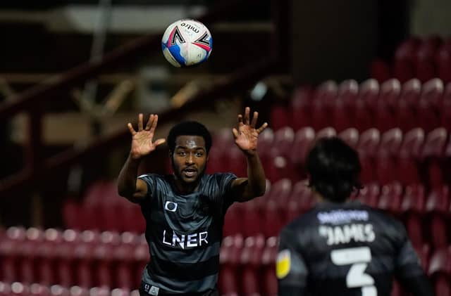 Cameron John throws in to Reece James. Picture: Steve Flynn/AHPIX