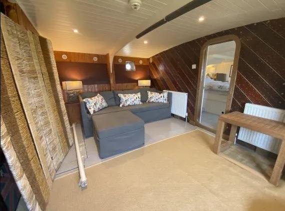 There is a sitting room/ office area beneath the main staircase.