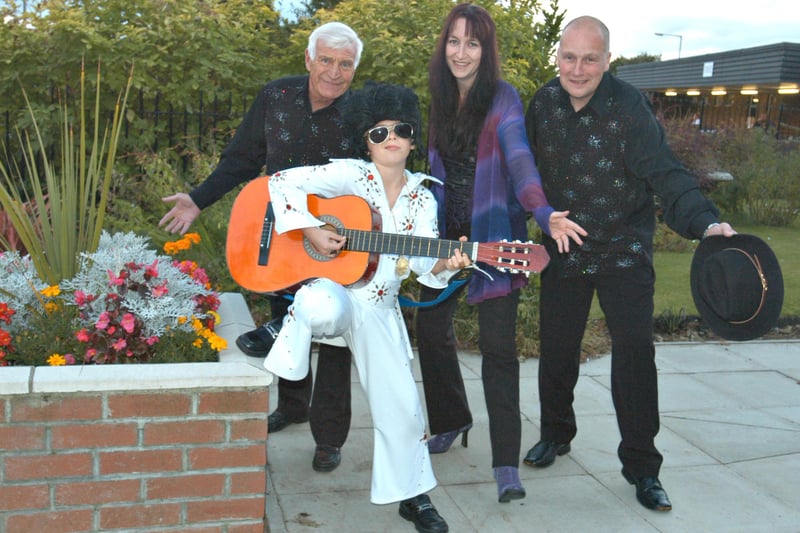 'Young Elvis' Christopher Wharton was pictured with fellow entertainers as they prepared for a charity concert 16 years ago.