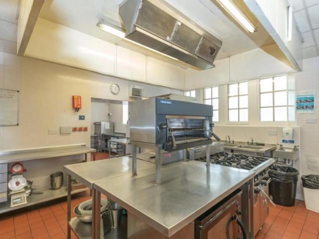 An inner hall leads to a fully equipped commercial kitchen, which comes with a refrigeration area, storage for appliances, crockery, wine store and three individual stone pantries
