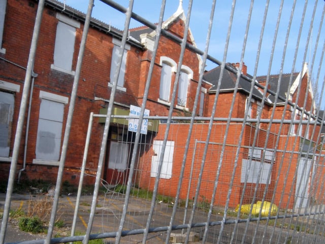 Boarded up just prior to demolition.