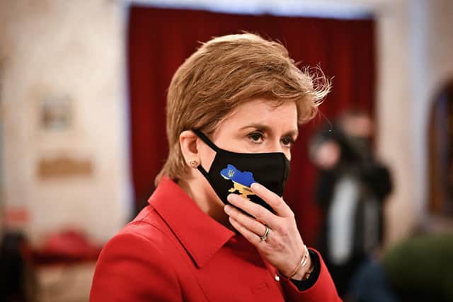 Nicola Sturgeon wears a face mask with a map of Ukraine on it as she meets members of the Ukrainian Community at the Edinburgh Ukrainian Club