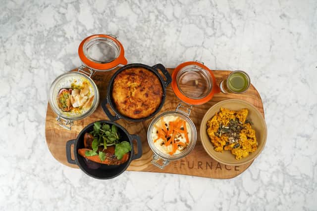 Brunch board containing scrambled tofu; plant based smoked sausage; jalapeno cornbread; passion fruit and coconut chia yoghurt pot; carrot cake overnight oats and green juice boost. Picture: Scott Merrylees