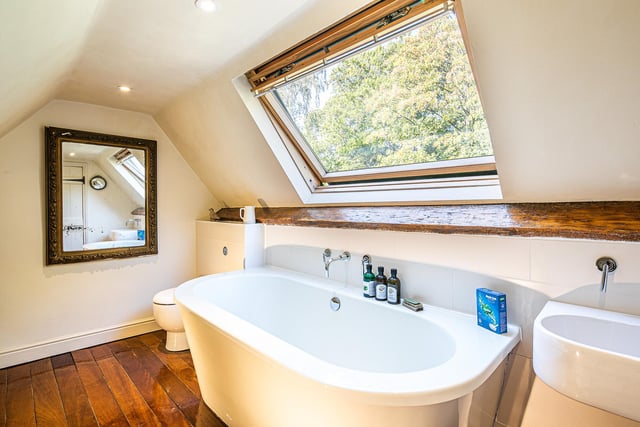 This upstairs bathroom features a Velux-style window.