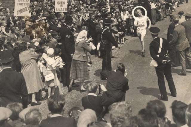 21 year old R.K.Keightley (ringed) wins the 30th annual Star Walk outside Corporation Street May 22nd 1956