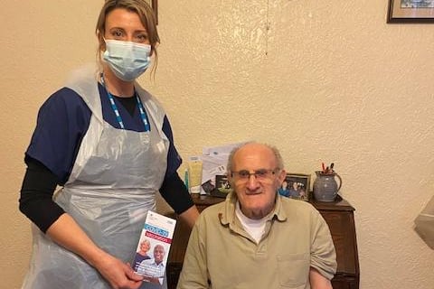 Staff from Sett Valley Medical Centre pulled out all the stops to make sure isolated elderly people were able to receive the vaccine in their own homes. Pictured are Advanced nurse practitioner Katie Cobain with patient Geoffrey Smith, 84