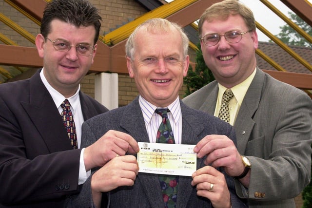 Doncaster Roundtable presented St John's Hospice with a cheque for £1,220 in 2000. Our picture shows Roundtable representatives Kevin Kerley (left) and Andy Leslie handing the money over to John Clark, chairman of the Doncaster Cancer detection rust and the St John's Hospice Appeal.