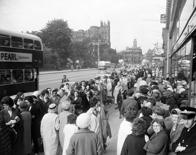 Hundreds of shoppers queue up on Princes Street for the annual sales in July 1963.