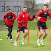 Oliver Arblaster, Ciaran Clark and Chris Basham of Sheffield United in training: Lexy Ilsley/Sportimage