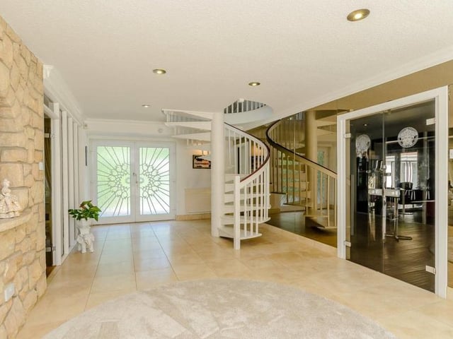 As soon as you go in via double doors and make your way into this spacious, tiled entrance hall, you are struck by the class and style of the property. Off to the right is the main reception room, a split-level space occupying a dining area and a sitting area.