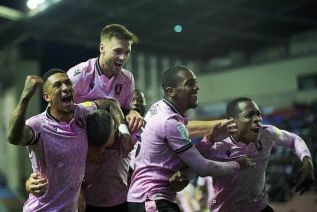 Sheffield Wednesday celebrate Callum Paterson's winning goal as they took three points from Wigan Athletic.