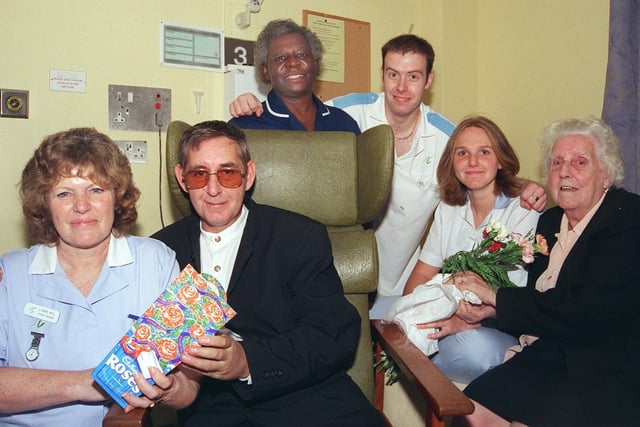 Pictured at Brearley 2 at the Northern General Hospital, Sheffield, in 1999 is stroke victim Stuart Burberry who said thank you to the staff who looked after him during his stay in hospital. Seen left to right are: Staff Nurse Lynne Neil, Stuart Burberry, Sister Hetta Phipps, Support Worker Brendan Wragg, Staff Nurse Lucy Wakefield, and Stuart's mother Bessie.